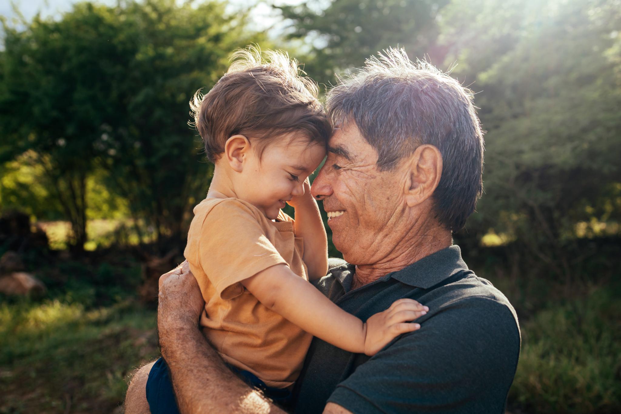 playful grandfather spending time with his grandson